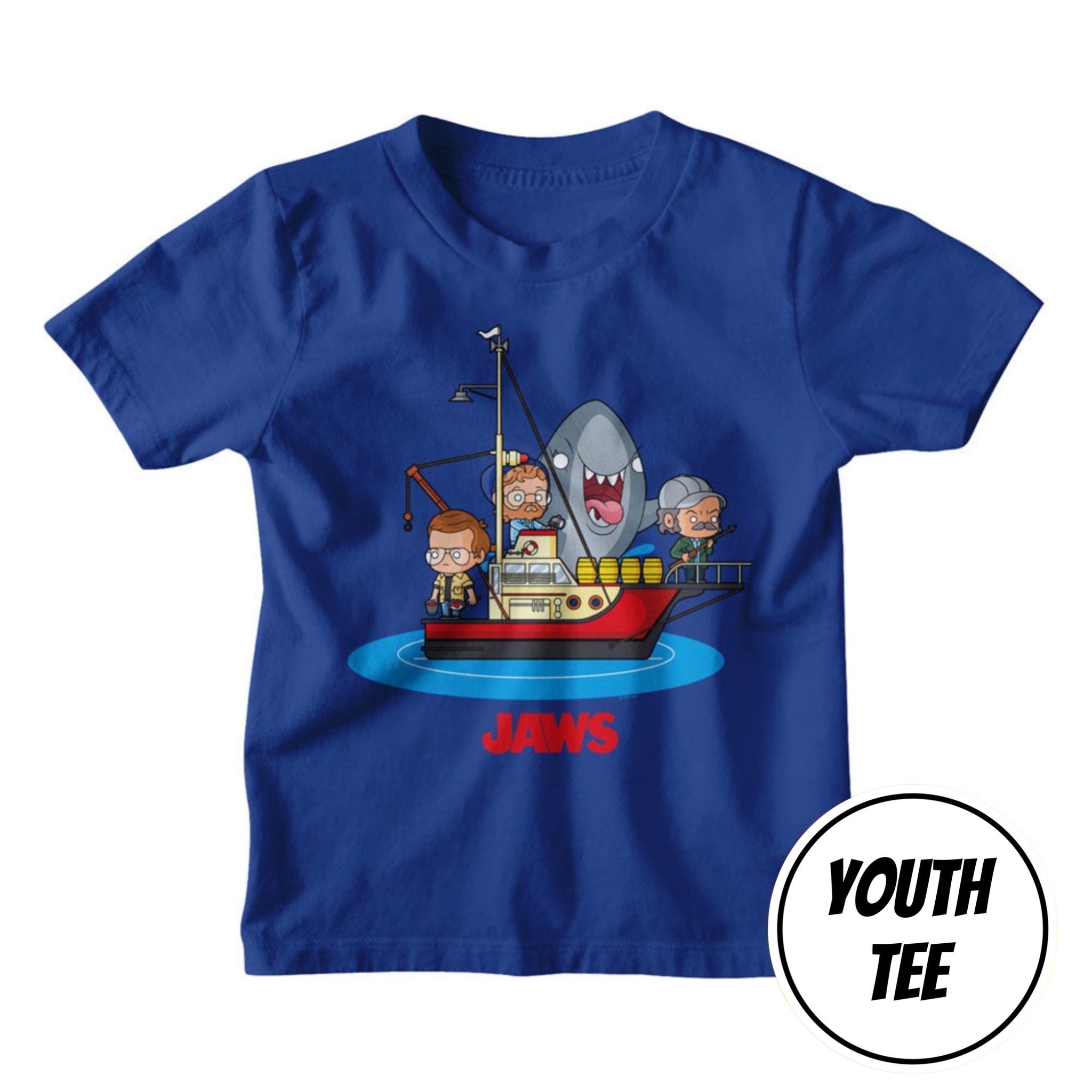 A royal blue youth short-sleeve t-shirt featuring a cartoon graphic of characters on a boat with a shark and the word 'JAWS' underneath. A white circular badge in the bottom right corner reads 'YOUTH TEE'.