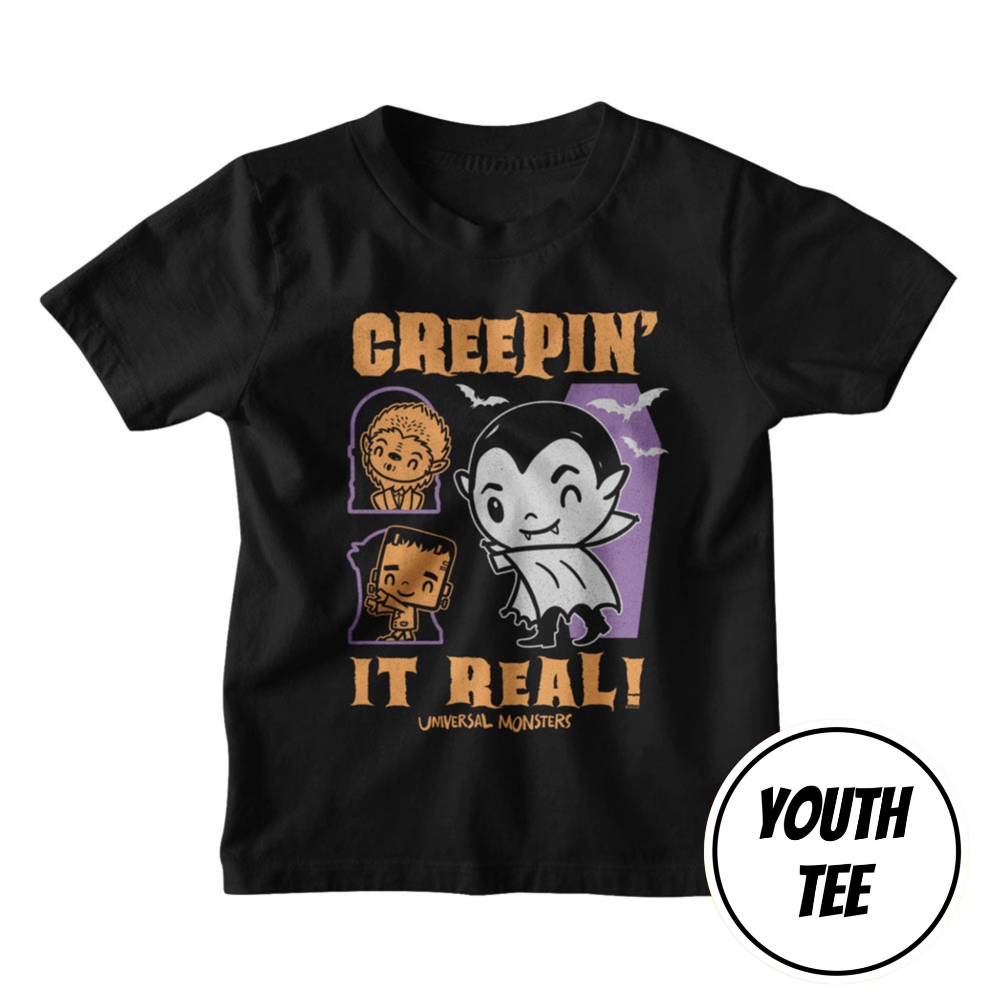 A youth black short-sleeve t-shirt with a graphic print featuring Universal Monsters characters and the text 'GREEPIN' IT REAL!' in orange and purple. A white circular badge in the bottom right corner reads 'YOUTH TEE'.