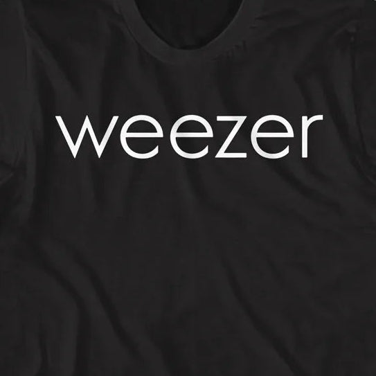 A black short-sleeve crewneck t-shirt with the word 'weezer' printed in white lowercase letters across the chest, displayed flat against a solid black background.