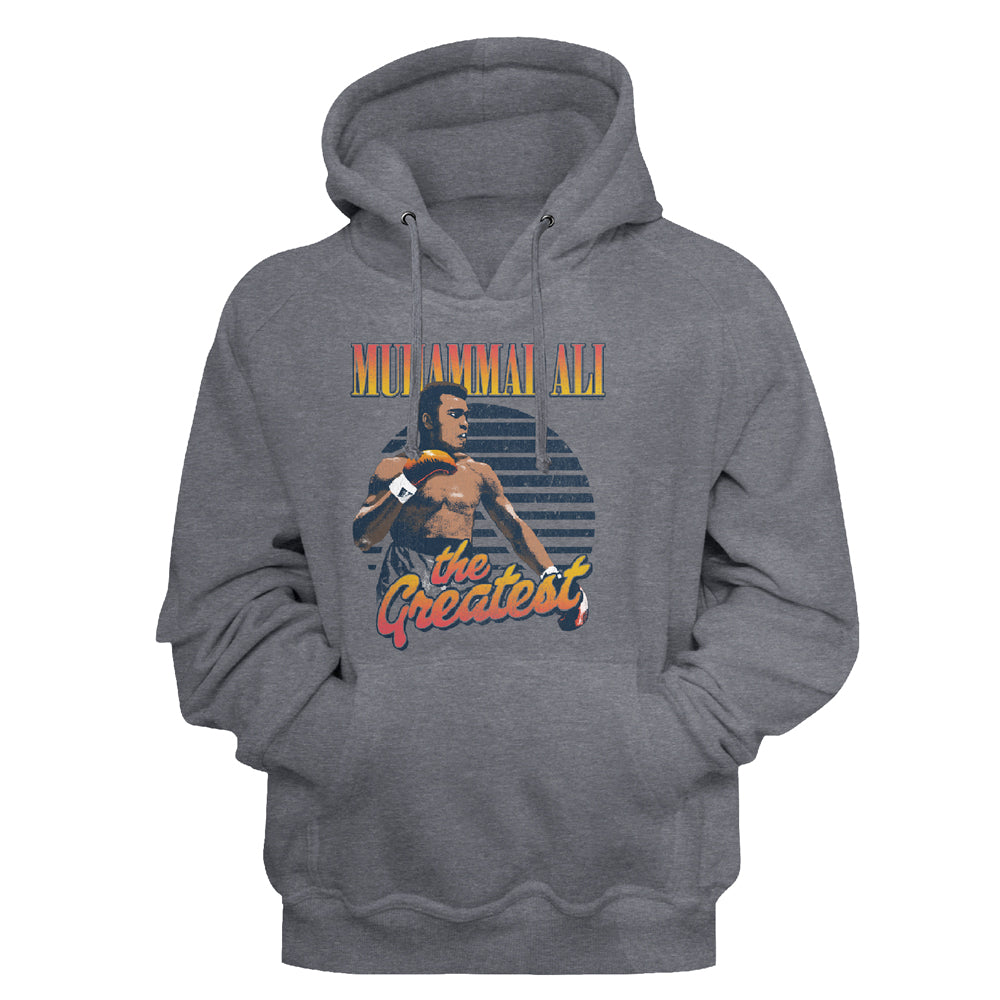 A heather gray pullover hoodie featuring a graphic print of Muay Thai artist Pet Kiatnoi with the text 'MET AMMAZING ALL THE Greatest' in a retro orange and yellow font, shown against a plain white background.