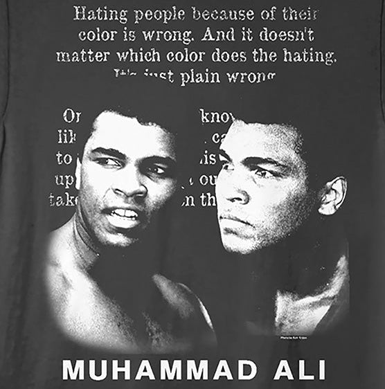 A black short-sleeve crewneck t-shirt featuring a white graphic print of Muhammad Ali's face, a quote, and the text 'MUHAMMAD ALI' printed in white at the bottom.
