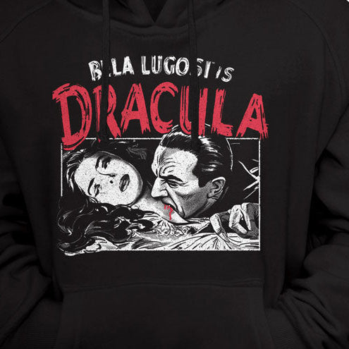 A black pullover hoodie featuring a graphic print of Dracula's laundry advertisement on the front, with red and white text and an illustration of two characters.