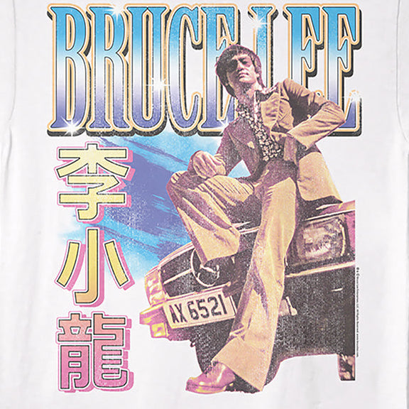 A white short-sleeve crewneck t-shirt featuring a large graphic print of Bruce Lee sitting on a car, with 'BRUCE LEE' in stylized blue and yellow lettering and Chinese characters printed vertically in pink.