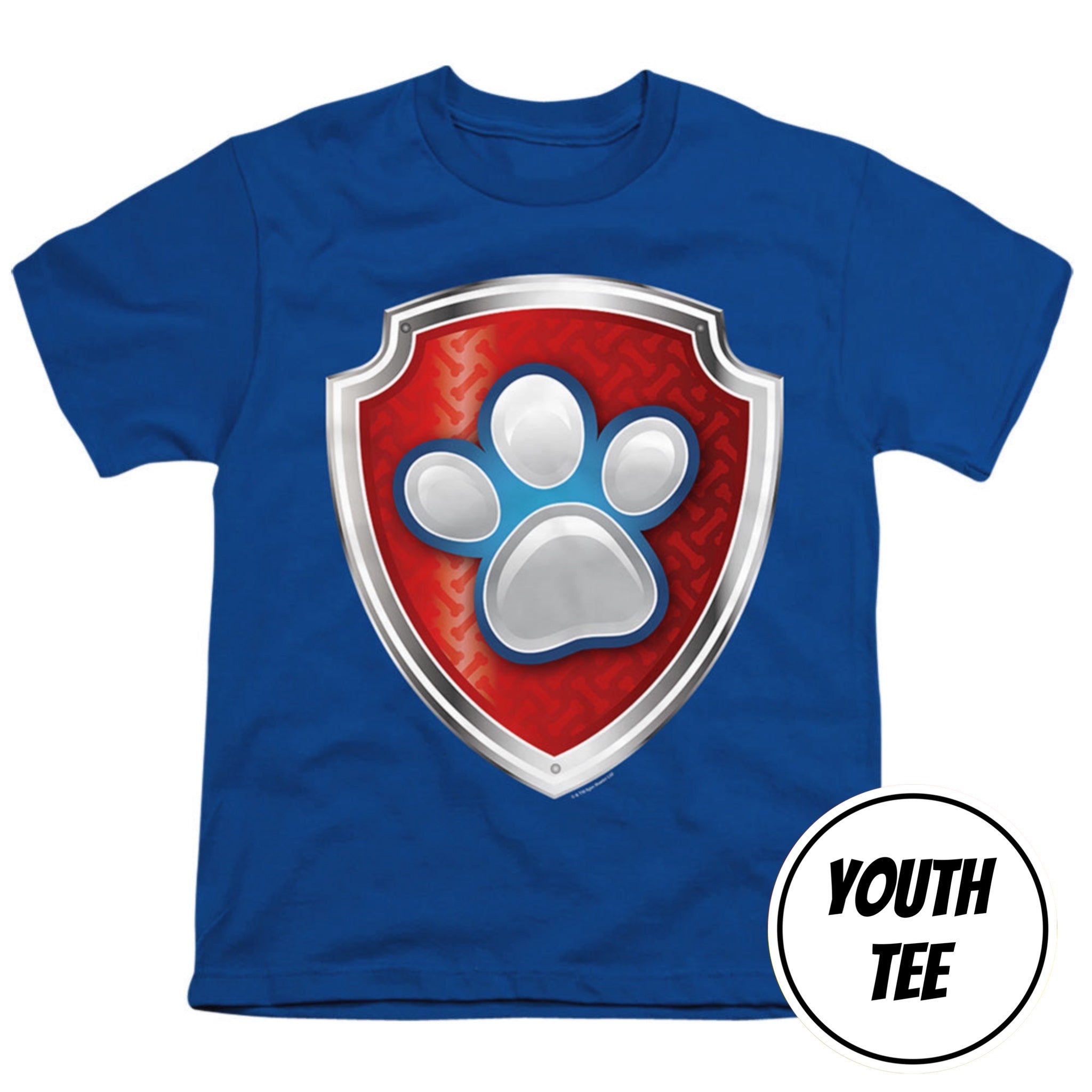 A royal blue youth t-shirt featuring a large Paw Patrol shield graphic on the chest with a red background and silver paw print. A white circular badge in the bottom right corner reads 'YOUTH TEE'.