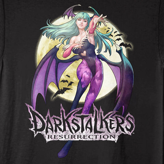A black short-sleeve graphic t-shirt featuring a stylized illustration of a vampire woman with purple wings and teal hair, with the text 'Darkstalkers Resurrection' printed below the graphic.