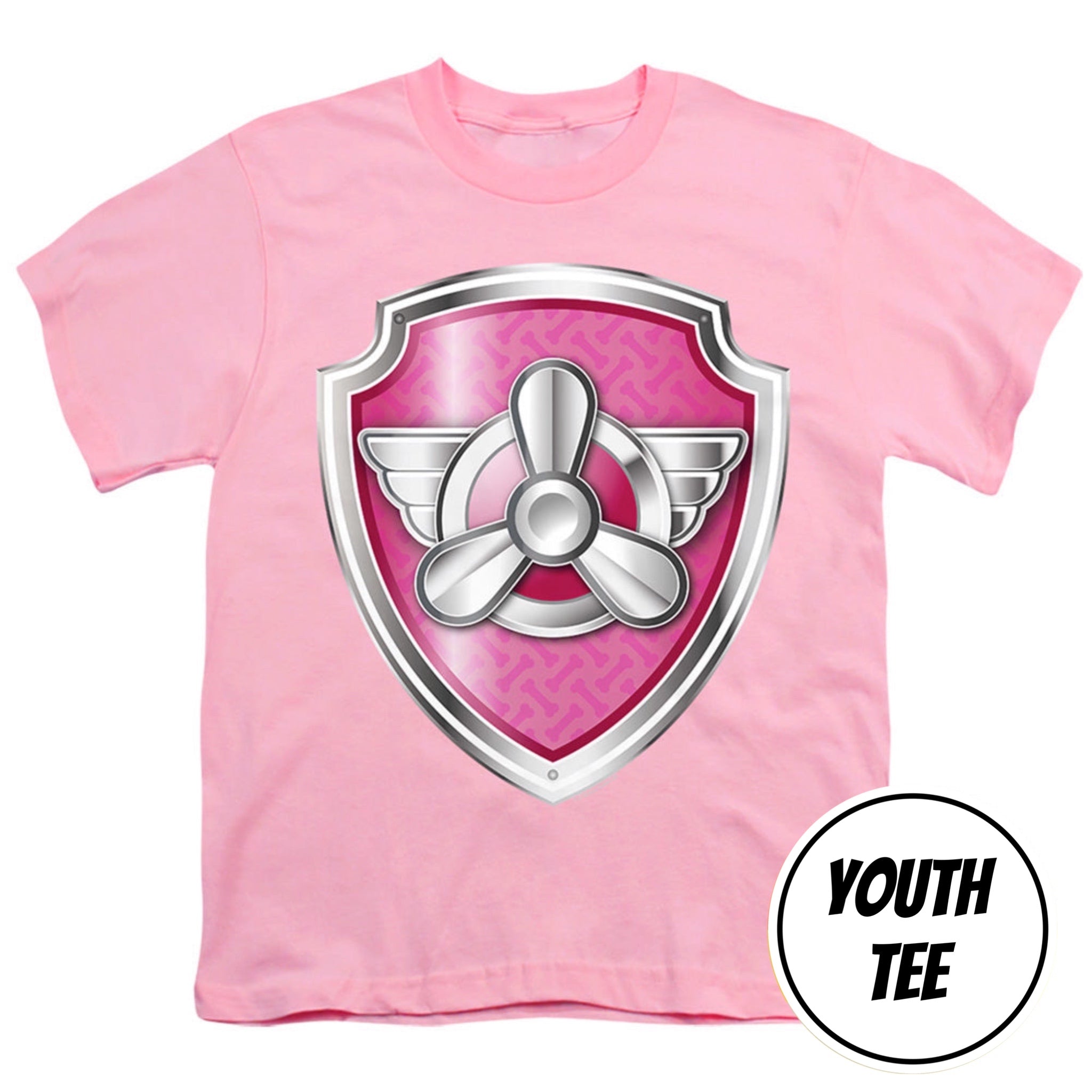 A pink short-sleeve youth t-shirt featuring a large shield graphic on the chest with a silver propeller and pink patterned background. A white circular badge in the bottom right corner reads 'YOUTH TEE'.