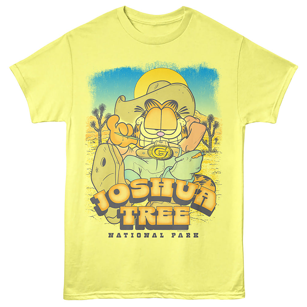 A pale yellow short-sleeve graphic T-shirt featuring Garfield as Joshua Tree National Park, with a large western-style illustration and the text 'JOSHUA TREE NATIONAL PARK' on the front.