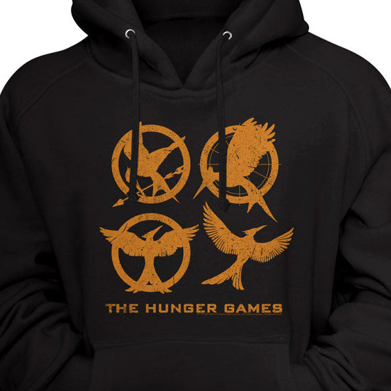 Black hoodie with orange 'The Hunger Games' symbols on a black background