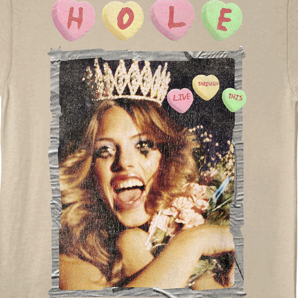 Beige t-shirt with a graphic of a woman with a crown and colorful hearts on a white background