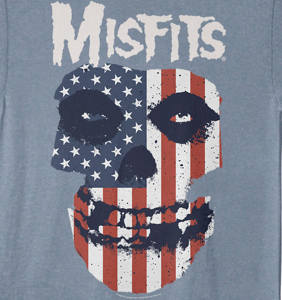 Blue t-shirt with a graphic design of a skull with an American flag pattern and the word 'Misfits' on a blue background.