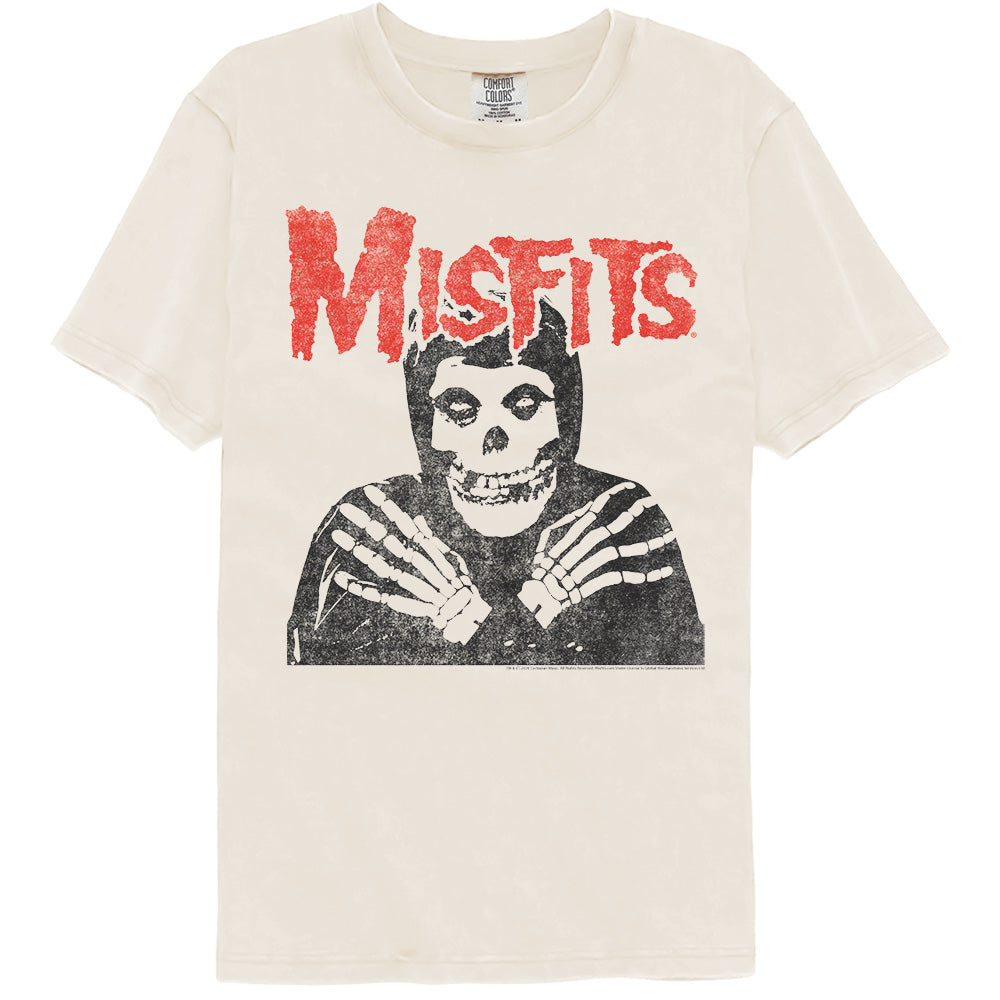 An off-white short-sleeve t-shirt featuring a distressed red 'Misfits' logo and a black-and-white graphic of the band's mascot, Misfits Joe, on the front.