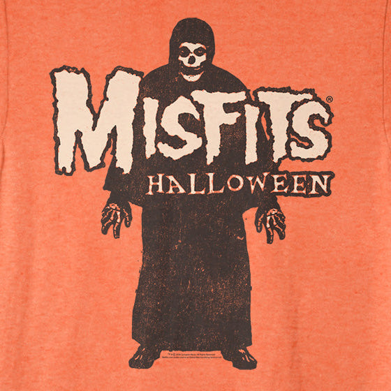 A heather orange crewneck t-shirt featuring a distressed graphic of a hooded figure with a skull face and the text 'Misfits Halloween' printed on the front.