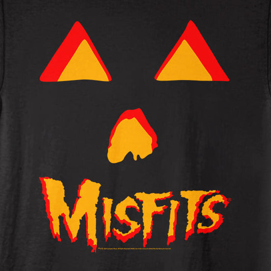 A black short-sleeve t-shirt featuring a Misfits-themed graphic print with two red and orange triangles for eyes, a red and orange flame shape for the nose, and the word 'Misfits' in a red and orange flame-style font below.