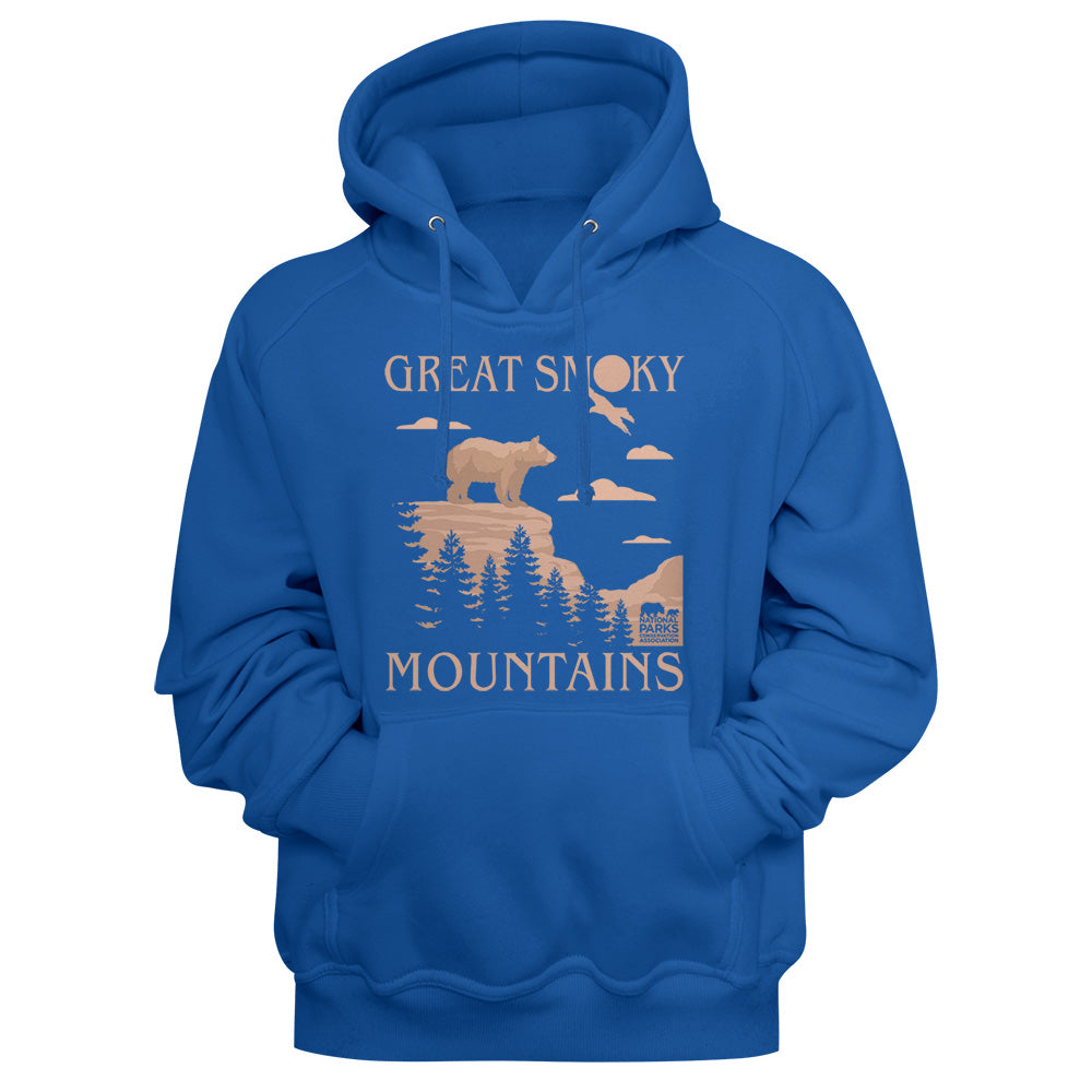 A royal blue pullover hoodie with a vintage-style front graphic that reads 'GREAT SMOKY MOUNTAINS' in beige, featuring a bear, trees, mountains, and a small cabin illustration.