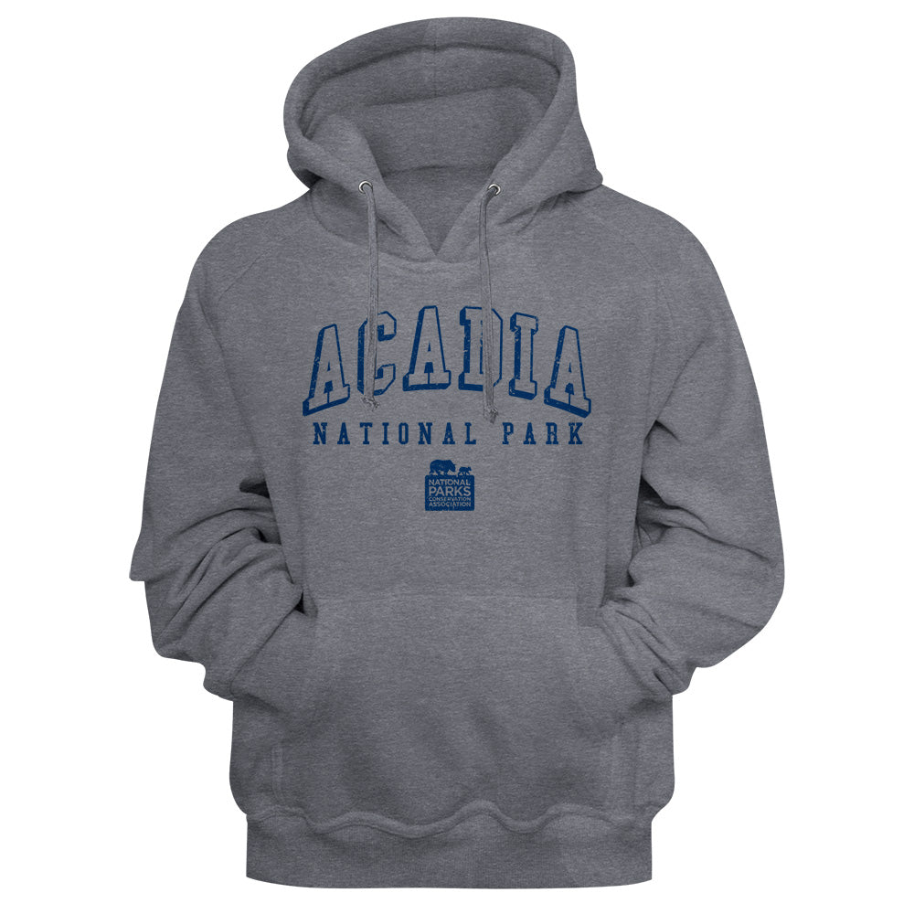A heather gray pullover hoodie featuring a blue graphic print on the chest that reads 'ACADIA NATIONAL PARK' with a small park logo underneath, shown against a gray background.