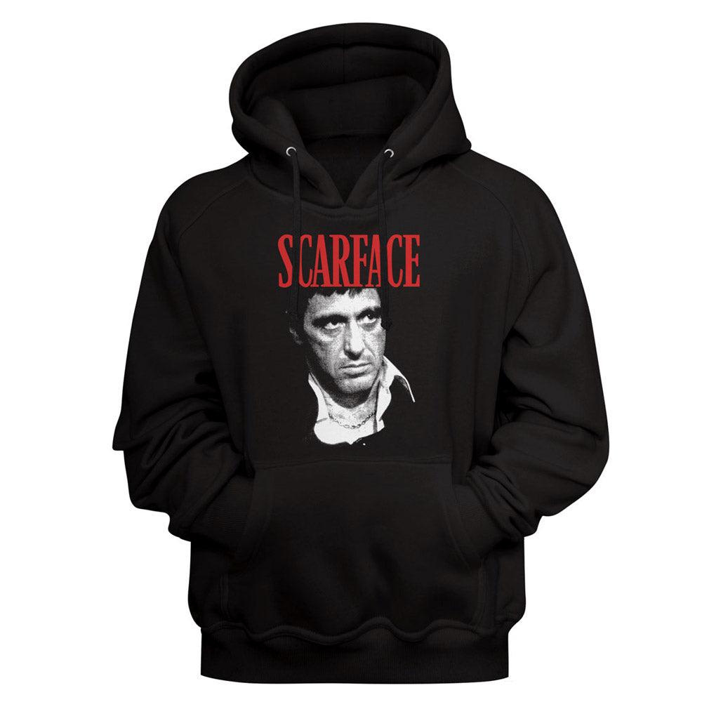 A black pullover hoodie featuring a graphic print of Scarface's portrait and the word 'SCARFACE' in red text across the chest, shown against a plain black background.