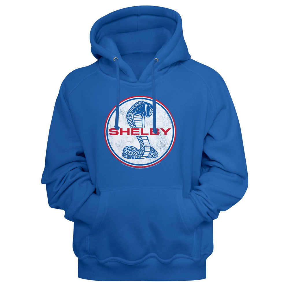A royal blue pullover hoodie featuring a circular chest graphic with a coiled cobra snake and the word 'SHELBY' in red and blue.