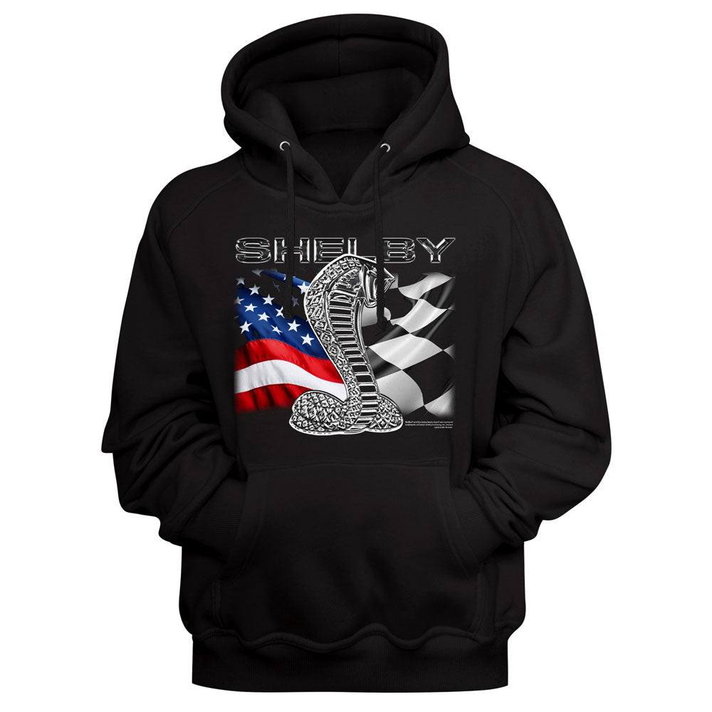 A black pullover hoodie featuring a front graphic print of a silver cobra snake over a black-and-white checkered flag and an American flag, with the word 'SHELBY' above it.