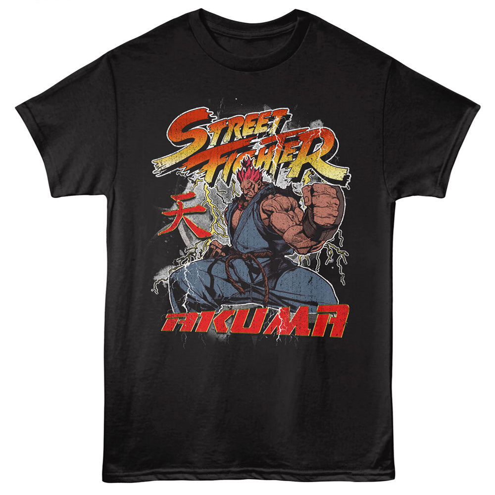 A black short-sleeve crewneck t-shirt featuring a colorful graphic print of Street Fighter's character Mikaru in a fighting pose, with 'Street Fighter' and 'Mikaru' text on a black background.