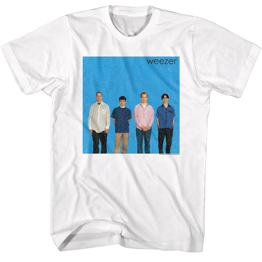 White crewneck t-shirt featuring a square graphic print of the band Weezer on a bright blue background, displayed flat against a white background.
