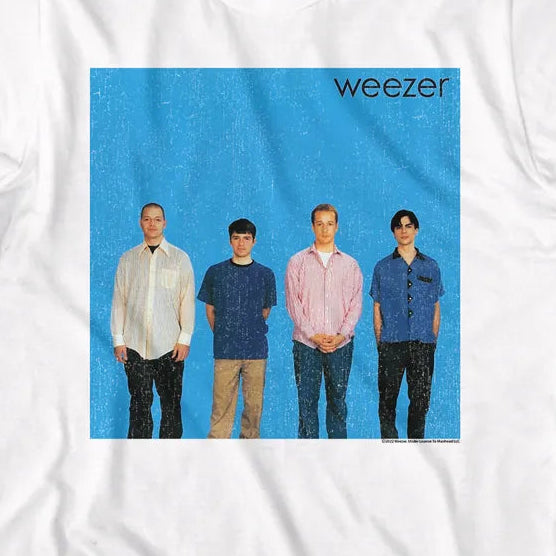 White crewneck t-shirt featuring a square graphic print of the band Weezer on a bright blue background, displayed flat against a white background.